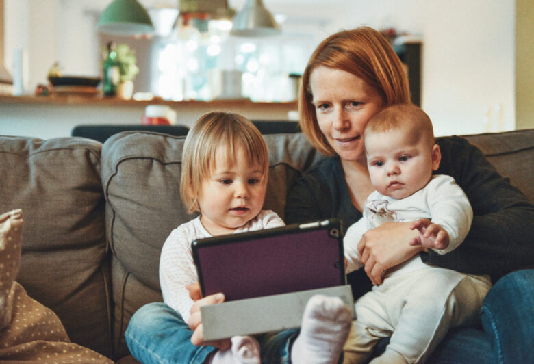 a mom of 2 reading a blog about how save money for her family on Mortgage Rate Utah