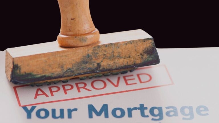 Approved rubber stamp on a mortgage document.