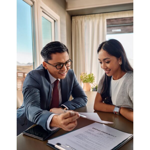 man and woman sitting at a table and discussing mortgage rates