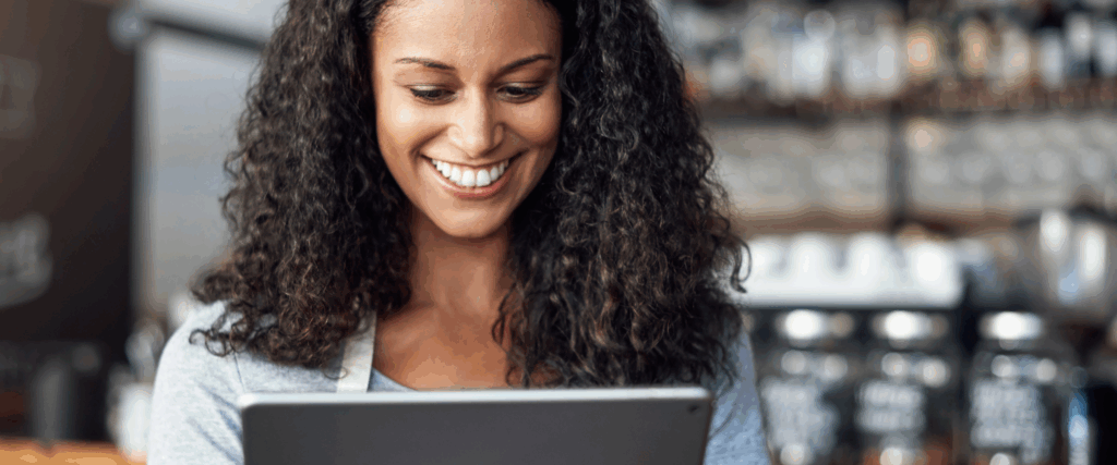 Smiling woman learning about FHA mortgage options online