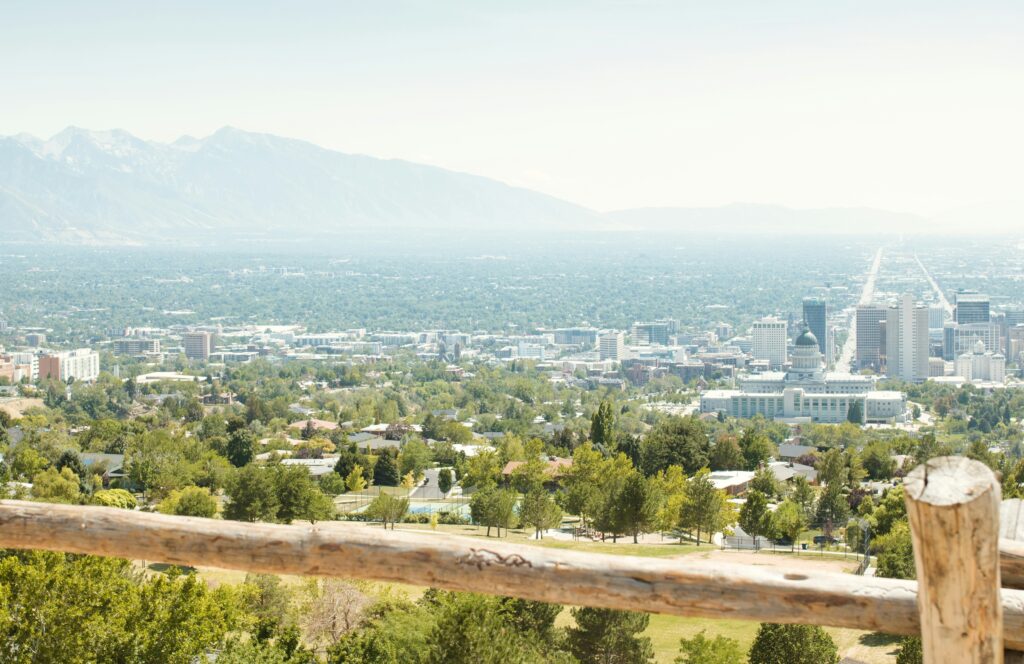 View of Salt Lake City skyline with Wasatch Mountains,showing real estate variety