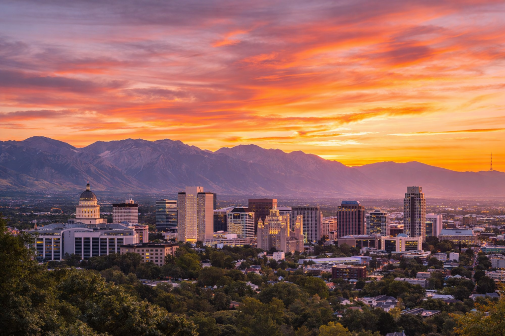 A wide-angle view of the Salt Lake City skyline at sunset representing Utah mortgage rates