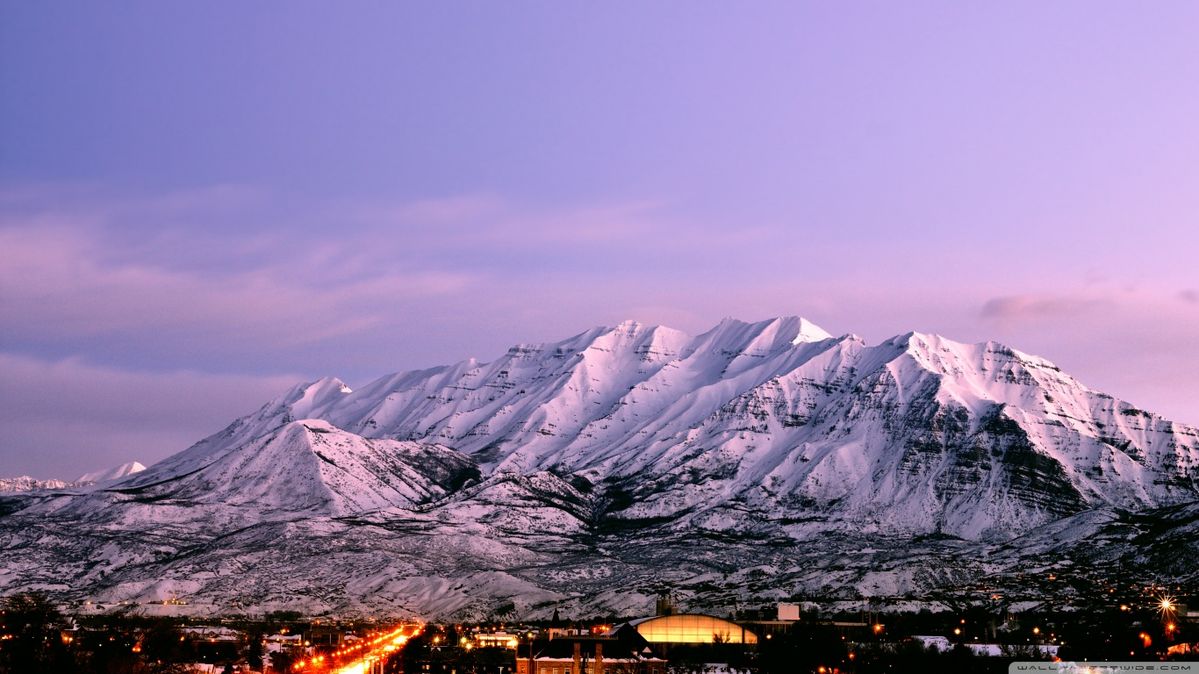 Mount Timpanogos overlooking Provo Utah at dusk representing Utah home loans and real estate