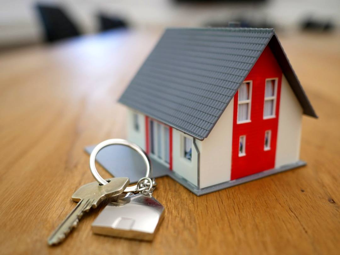 Model house with keys representing first time home buyer programs utah and the path to homeownership