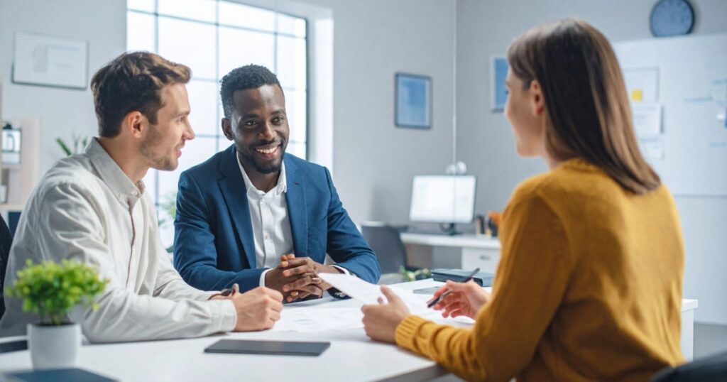 Utah first-time home buyers discussing how much house I can afford with a mortgage lender