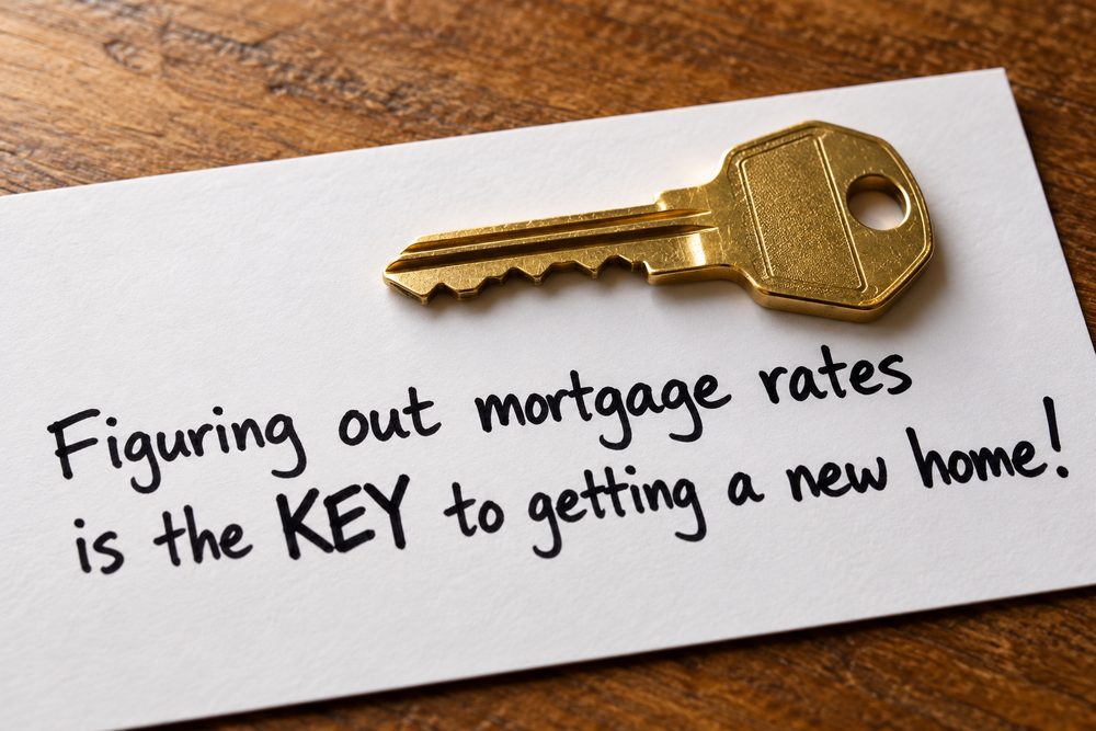 Gold key on a handwritten note about mortgage rates